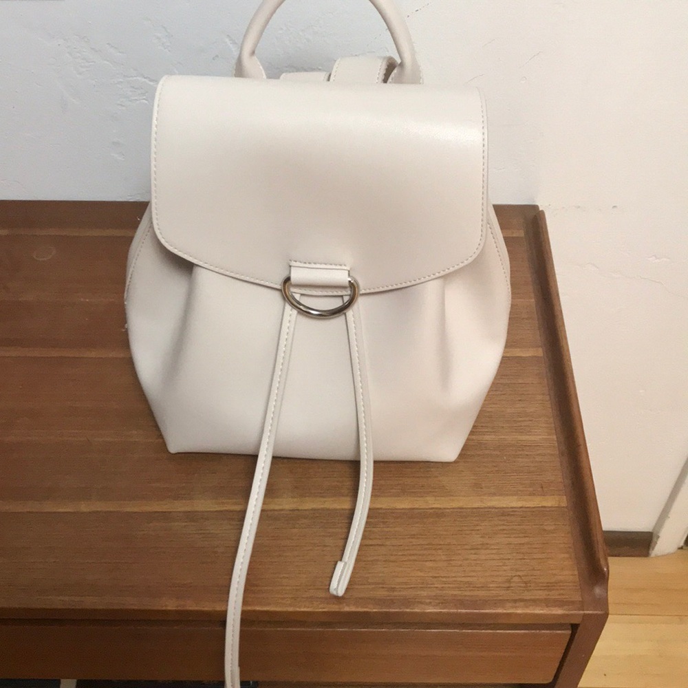 Faux leather off white back pack bag